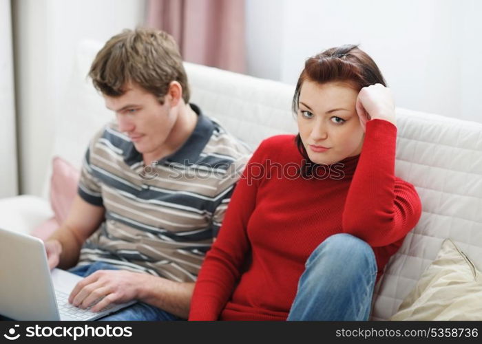 Girl frustrated that boyfriend spending lot of time at laptop