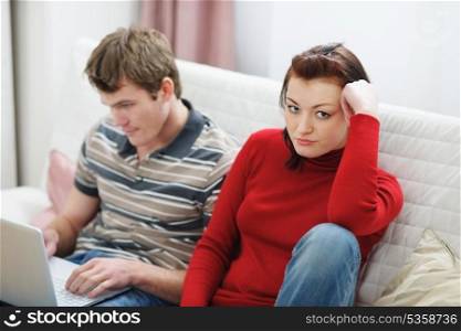Girl frustrated that boyfriend spending lot of time at laptop
