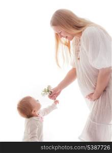Girl gives snowdrops to pregnant mother, isolated on white