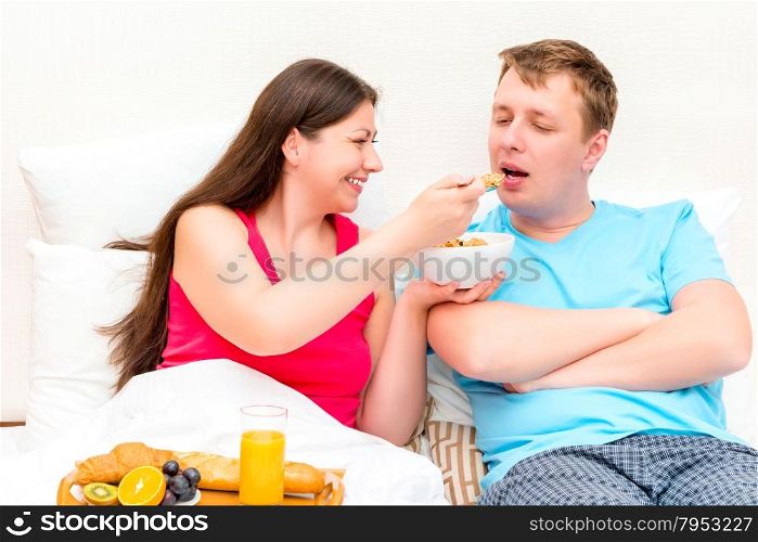 girl gives to her husband taste muesli