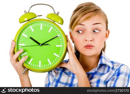 Girl giving funny expression and holding the alarm on a isolated white background