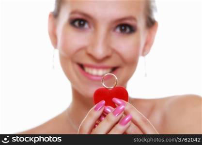 Girl happy bride in white dress showing engagement or wedding ring in red heart shaped box isolated on white background.