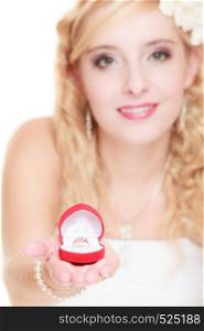 Girl happy bride in white dress showing engagement or wedding ring in red heart shaped box isolated on white background.