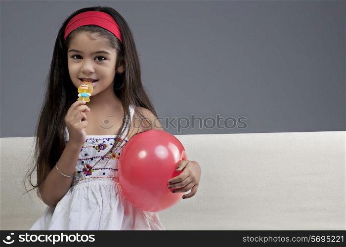 Girl having a lollipop