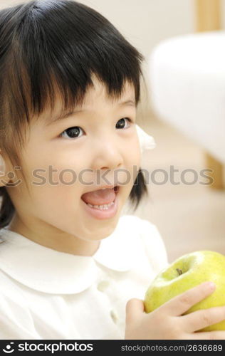 Girl having an apple