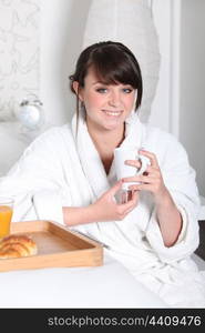 Girl having breakfast in bed