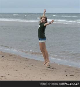 Girl having fun on the beach, York Point, Prince Edward Island, Canada