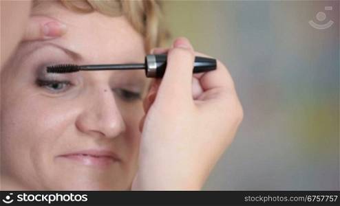 girl having makeup applied