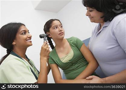 Girl having medical examination at doctors