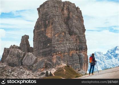 girl hiker at the mountains Dolomites, Italy. Cinque Torri