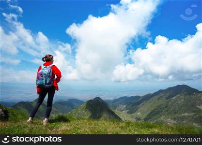 girl hiker on a path at the mountains. Transfagaras. Romania