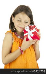 girl holding a gift box in her hand