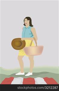 Girl holding a hat and carrying a hand bag