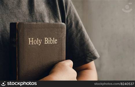 girl holding and hugging a bible at dawn Joining Hands in Biblical Prayer in Christian Concepts worship and religion copy space