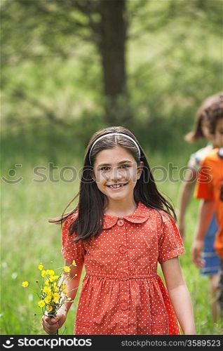 Girl Holding Bunch of Wildflowers