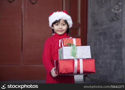 Girl Holding Christmas Gifts