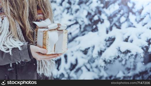 girl holding christmas presents in hands - happy New Years