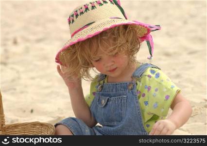 Girl holding hat