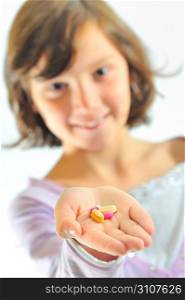 girl holding pills