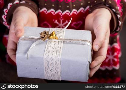 girl holding presents in hands