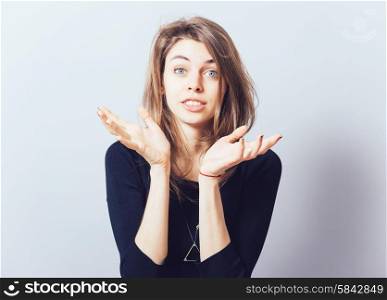girl holding something in his hand. Isolated on gray background