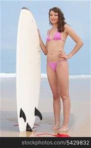 Girl holding surf board