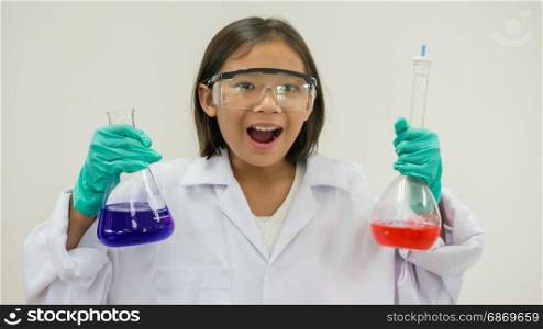 girl holding test tube. Asian little girl holding test tube or laboratory flask . Education concept.