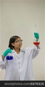 girl holding test tube. Asian little girl holding test tube or laboratory flask . Education concept.