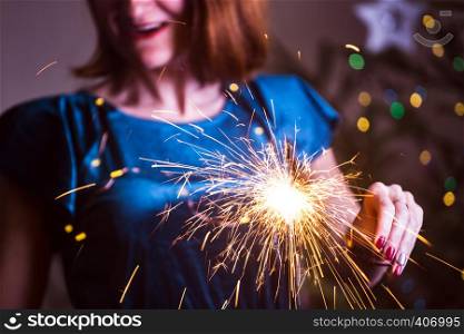 girl holds bengal lights - happy christmas and merry holidays
