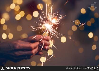girl holds bengal lights - happy christmas and merry holidays