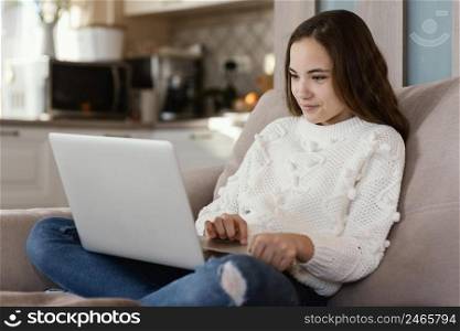 girl home with laptop