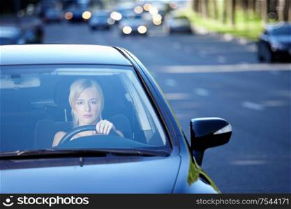 Girl in a car traveling on a busy highway