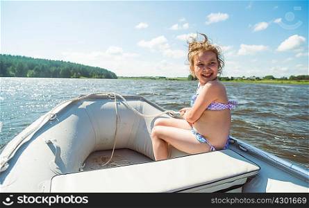 Girl in a dinghy, Rezh River, Sverdlovsk Oblast, Russia