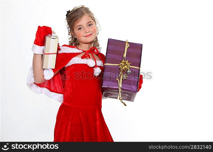 Girl in a Santa costume bearing gifts
