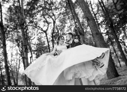 girl in a wedding dress in the autumn forest against the background of wild trees