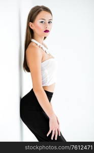 girl in a white blouse and black skirt on a white background