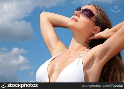 Girl in bathing suit and sunglasses