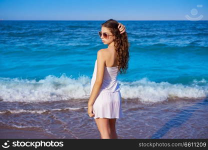 Girl in beach sea shore with summer white dress