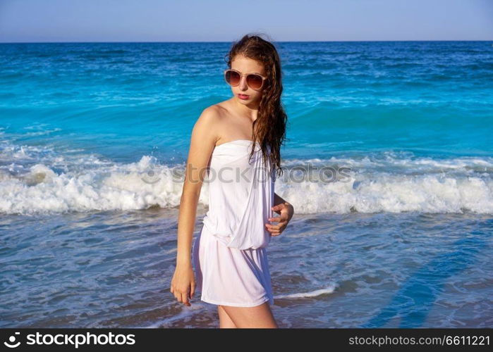 Girl in beach sea shore with summer white dress