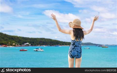 Girl in bikini on a windy beach in thailand