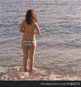 Girl in bikini standing in the water