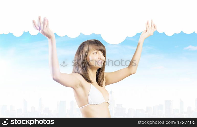 Girl in bikini. Young attractive girl holding white blank banner above head