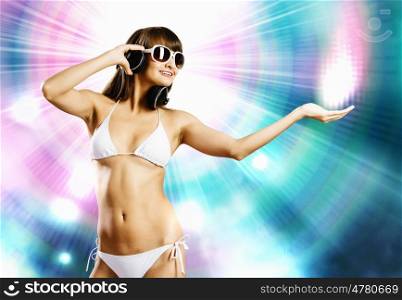 Girl in bikini. Young attractive girl in white bikini and headphones