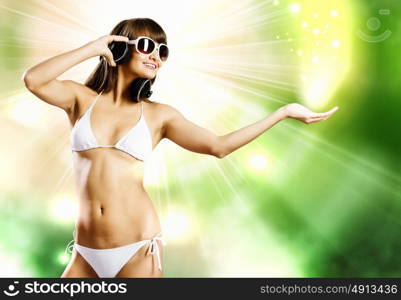 Girl in bikini. Young attractive girl in white bikini and headphones