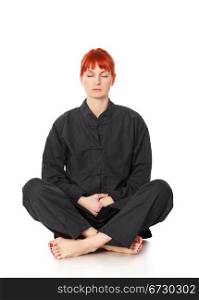 girl in black kimono siting and meditation isolated on white