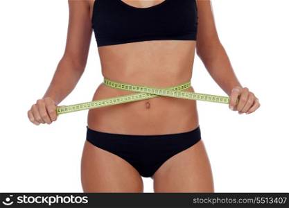 Girl in black underwear with a tape measure around her waist isolated