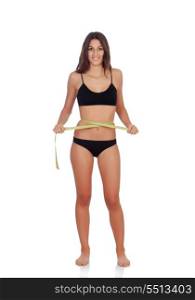Girl in black underwear with tape measure isolated