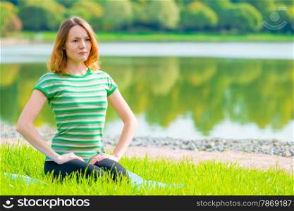 girl in green t-shirt at the lush grass playing sports