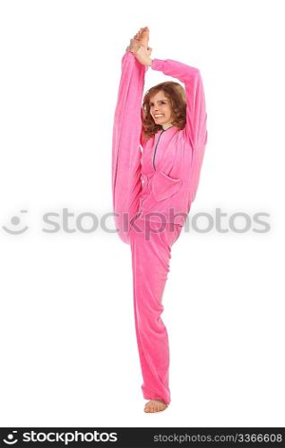 Girl in pink clothes holds leg vertically upwards