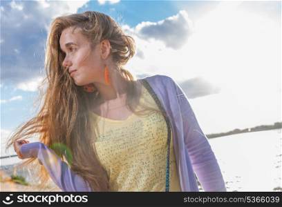 Girl in profile. Portrait of happy woman looking away against clear sky